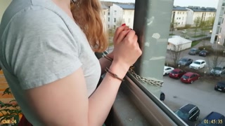 Cuffed to Balcony Wearing a Thick Diaper
