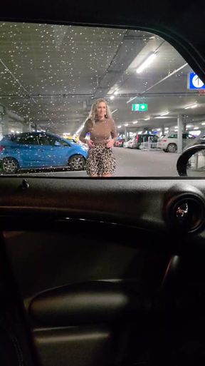 Woman in rainy parking lot