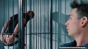 Dirty cop Luka Sage fists prisoner Josh Mikael on the precinct desk