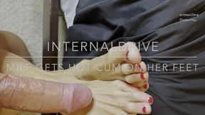 Milf gets hot cum on her feet and licks it off.