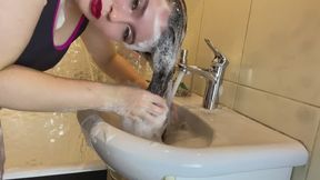 hair washing in the sink with lots of shampoo