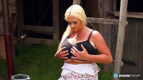 Emilia Boshe's big tits and wet pussy get played with outdoors