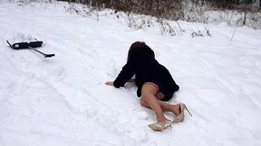 Frozen feet, cleaning snow with a shovel on high heels sandals, nando muzi sandals in snow