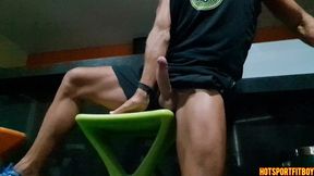 Fit guy jerks off his big cock in a crowded bar