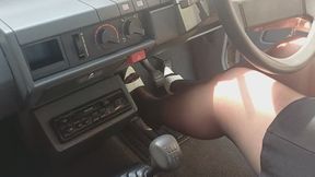 Cranking the Renault in Black Tights and White Mules