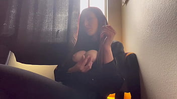Italian MILF with big tits and long hair smokes and shows off her perfect boobs
