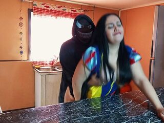 In suit, I drilled my stepmother who was clothed as Snow White for Halloween in the kitchen.