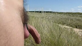 In the dunes at public beach playing with cock and balls