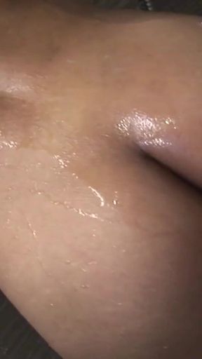 Brunette T-girl shows off her small cock