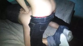 To my girlfriend in a gray shirt, I pull down her pants and put her in bed as a doggy