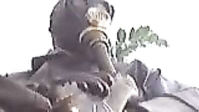 Kinky dude covered in rubber is jerking off and moaning