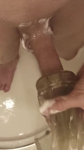The Guy Washes in the Shower and Plays with a Toy Masturbator, Gets Pleasure