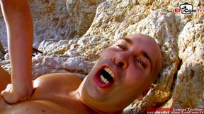 Dominant man fucks blonde Spanish woman in the ass on the beach and spits in her face
