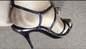 Showing my sexy legs wearing shiny glossy pantyhose and sexy high heeled sandals.
