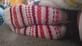 Chrissy resting socks on couch