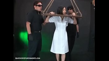 Horny Asian Submissive Bound In Wooden Stocks And Dominated