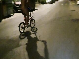 Sexy man undresses on a public street and rides a bike undressed touching his dong - risky
