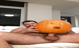 Playing with a huge pumpkin