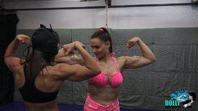 Dolly lift and carries Kim, muscular ladies flexing together