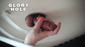 Milking a cock from a glory hole on the table