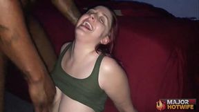 Curvy redhead Andi Ray deepthroats massive cock
