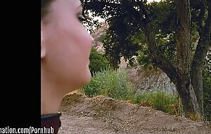 Submissive masochist Rocky Emerson tied atop a mountain and caned in the open air