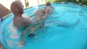 Pulling in her panties, she slaps her ass in the water W