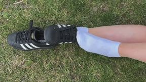 Shoeplay in adidas sneakers with socks and bare feet