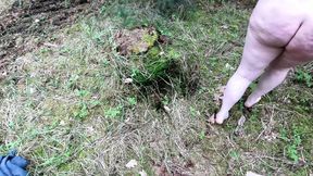 Complete naked girl in the woods and whipping her body and genitals