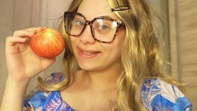 Blonde girl with glasses makes an ASMR video of herself eating
