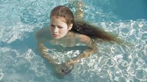 Beautiful Redhead's Playful Charm by the Poolside