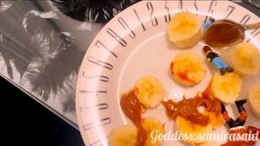 Giantess Samira enjoys her snack eating her tinys filled with dulce de leche and banana