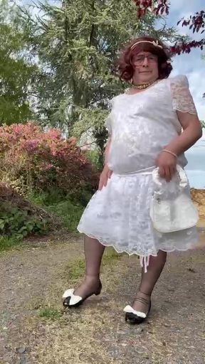 Dressed in a white lace dress for a day