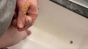 amateur boy pissing, with close-up and good quality slow motion of the load of pee coming out of the pee-hole (urethra)