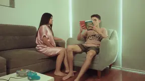 Horny girlfriend interrupting while he reads a book