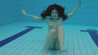 Red swimsuit beauty Katy with bushy pussy underwater