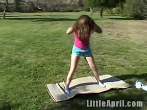 Little April strips and fingers her wet little pussy in public