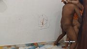 Desi aunty lifts her yellow maxi and the neighbour puts his dick in her juicy pussy standing by the wall.
