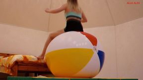 Alla bounces high on a big beach ball and a big fitness ball!!!