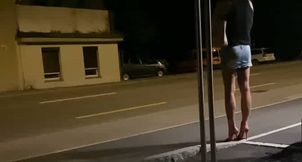 At the bus stop at night