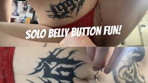 goth girl fingers her belly button and plays with navel piercing