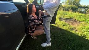 Busty blonde gives a blowjob in her sundress