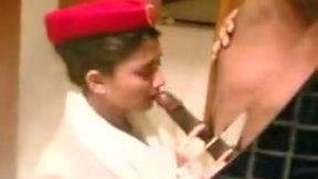 Asian flight attendant babe gives blowjob in hotel room