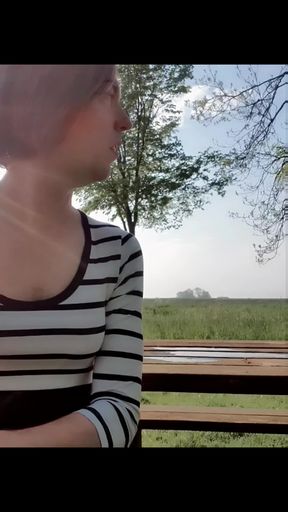 Risky outdoor piss on picknick bench