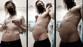 Skinny boy shows his bloated belly