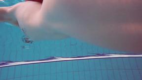 ”Half euro babe taking swimming classes in public pool”