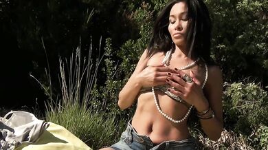 Suzie Q gets wild outdoors with her sex toy