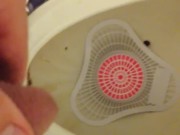 Pissing at the park urinal