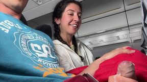 On the airplane, Katty West makes her neighbouring passanger aroused