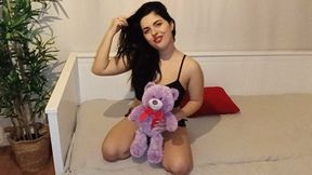 Brunette farting on teddybear